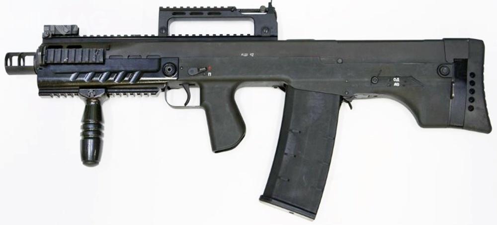 Podstawowym elementem systemu SzAK-12 jest automatyczny karabin specjalny ASz-12 (Awtomat Szturmowoj) w układzie bezkolbowym z gamą amunicji 12,7 mm x 55. Komorę zamkową 12,7-mm broni w układzie bezkolbowym wykonano ze stopu aluminium, a spustową z tworzywa sztucznego. Masa broni to 5,2 kg, długość 675 mm, szybkostrzelność 500-750 strz./min., zasięg skuteczny 300 m